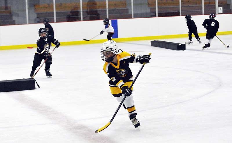 Lucas Woods skates in drills Wednesday as part of the Jefferson City Hockey Mites practice at the Washington Park Ice Arena. 