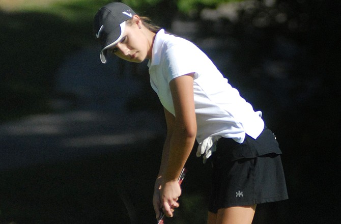 Hope Watson of the Jefferson City Lady Jays gets ready to roll a putt on the third green during Thursday's dual against the Southern Boone Lady Eagles at the Oak Hills Golf Center.