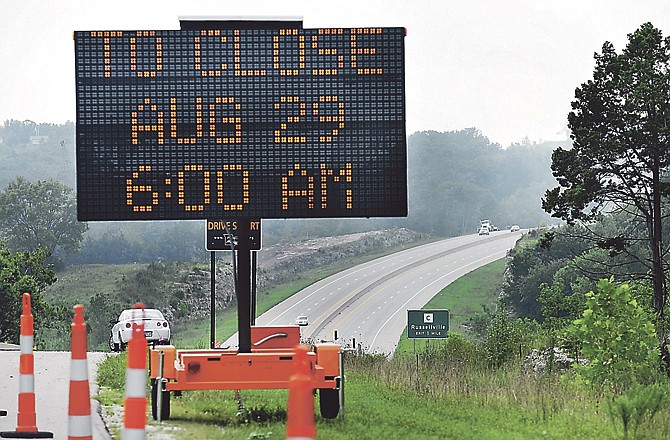 Smoke billows in the background as trees from hillsides are cleared in preparation for road construction. Starting August 29th at 6:00 a.m., Missouri 179 between Rt. C and W. Edgewood Dr. will be closed while an underpass is constructed for the new St. Mary's hospital.