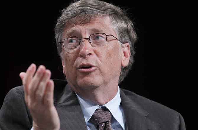 In this July 28, 2011 file photo, Microsoft founder Bill Gates speaks during a forum on education at the National Urban League annual conference in Boston. As CEOs, Sam Walton, Gates and Steve Jobs possessed common traits. Their companies also faced similar challenges when their iconic leaders left the helm.