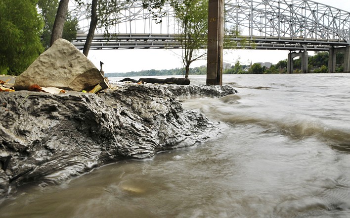 The receding water of the Missouri River at the Noren Access reveals interesting designs in layers of muddy silt, as created by the wave action of the in and out flow of the water. The depth of the mud represents the height of the water. For the first time since June, the level is below flood stage. 