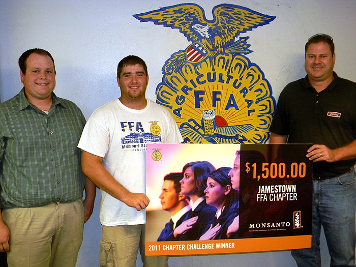 Monsanto Company Territory Sales Manager Jody Foutch, right, presents Jamestown FFA President Chad Cook, middle, and Advisor John Muri, left, with the $1,500 FFA Chapter Challenge Award which the California FFA Chapter won at a FFA meeting held Wednesday, Aug. 24.