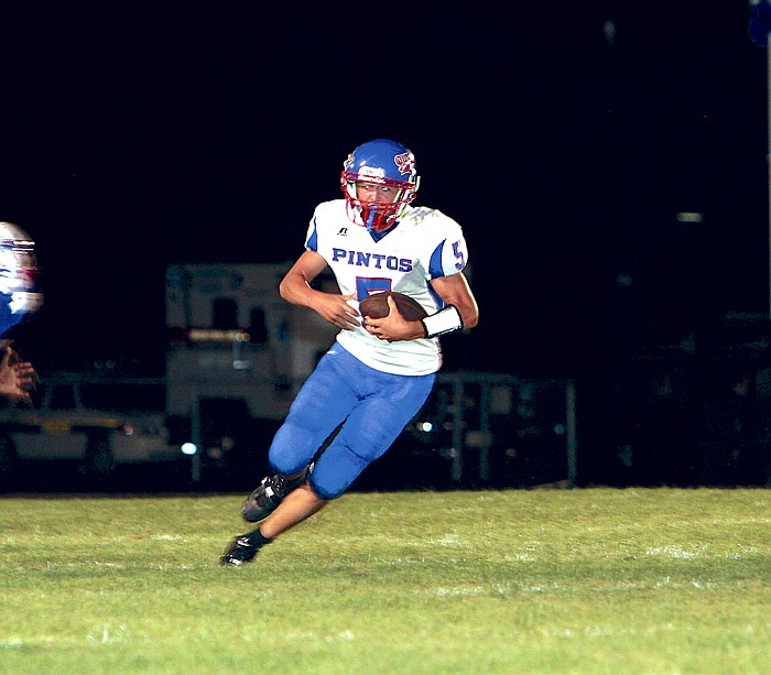 The California High School varsity football team opened the season with a game at Moberly Friday night, where the Pintos fell 21-6 to the Spartans. Above, California quarterback Dylan Albertson gains yards during the third quarter of the opener. California will host North Callaway at 7 p.m. Friday at Riley Field. The CHS Booster Quarterback Club will host a tailgate party beginning at 5:15 p.m. at Riley Field. The Parade of Champions, featuring the Pinto football players, will follow at 5:40 p.m.