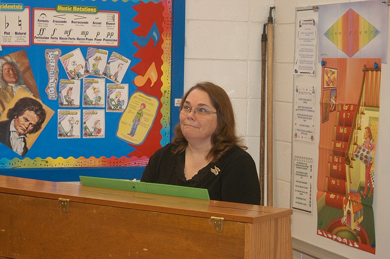 Marcia Burgher, the new California Middle School Vocal Music teacher, accompanies on the piano as a class practices a tune. She also directs the Pinto Express and Music Connections choirs. 