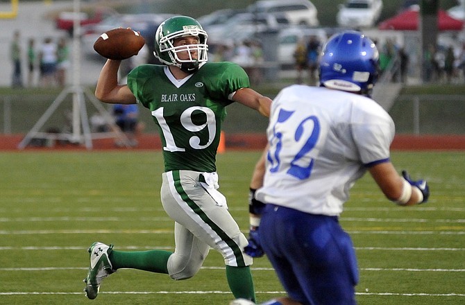 Blair Oaks quarterback Daniel Castillo tosses a touchdown pass during Friday's game against Grain Valley at the Falcon Athletic Complex.