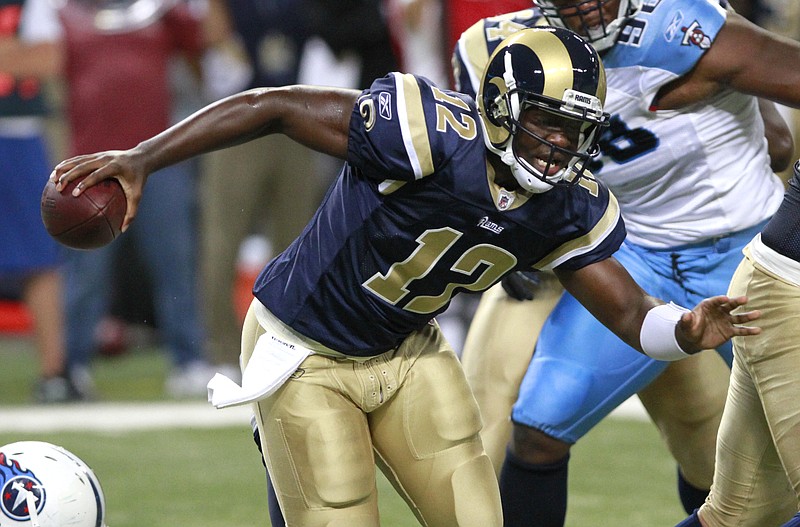 St. Louis Rams quarterback Thaddeus Lewis scrambles during the fourth quarter of an NFL football game against the Tennessee Titans Saturday, Aug. 20, 2011, in St. Louis. Lewis, who lost a battle for the backup quarterback job, was picked up by the Cleveland Browns on Sunday.