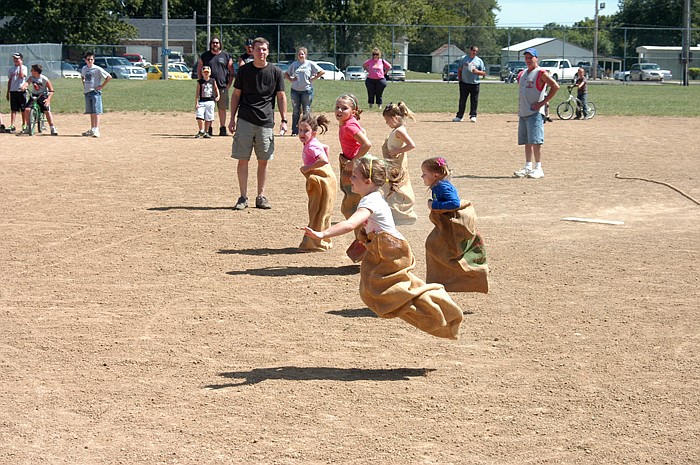 It's hot competition between the girls seven and under in the sack races at the Jamestown Labor Day Kids' Games on Monday. Lillian Rohrbach took first place and Jolene Sorrels took second.