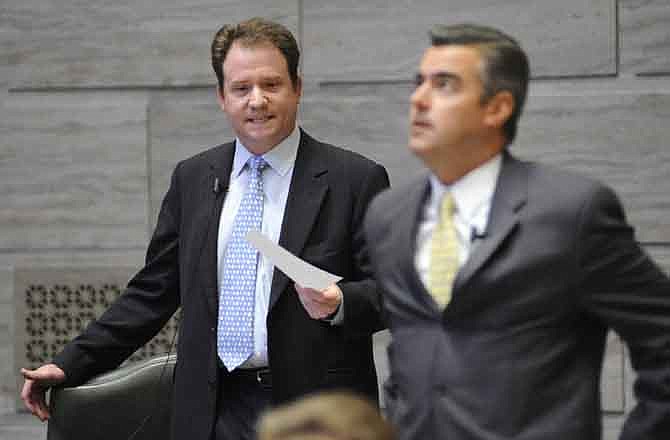 Sen. Jason Crowell, R-Cape Girardeau, left, begins to ask Majority Leader Tom Dempsey, R-St. Peters, right, questions about a routine motion shortly after the Senate convened for business during a special legislative session called by Gov. Jay Nixon Tuesday, Sept. 6, 2011, in Jefferson City, Mo. Dempsey had just moved to inform House members the senate was in session when Crowell was recognized to speak and took control of the floor. The procedure is normally approved without debate. Crowell has said he opposes some of the new tax credits being considered during the special session because he believes they do not allow enough protection for tax payers.