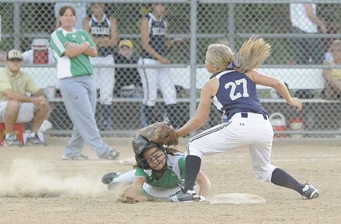 Helias shortstop Paige Bange makes the tag on Shannon Light of Blair Oaks in the top of the third inning of Tuesday's game at Duensing Field.