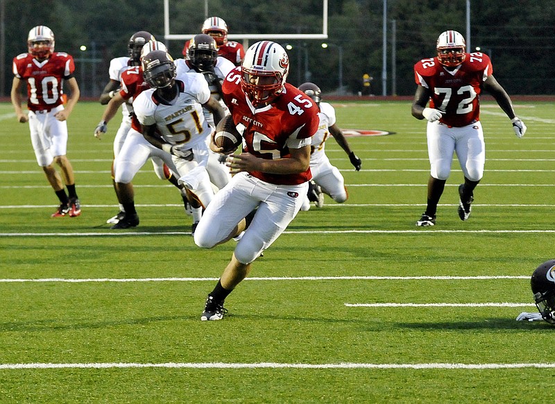 Scott Stegman of Jefferson City heads for the end zone after catching a pass from Jays quarterback Thomas LePage during Friday night's game against Hazelwood East at Adkins Stadium.