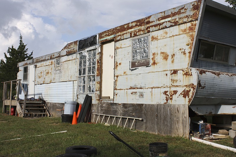 A recreational vehicle modified into a mobile home at 1673 County Road 340 near Millersburg is the scene where 54-year-old Deborah A. Bates was found murdered Thursday evening. She was living with Bryan Wiser, who neighbors say has lived at the location for more than 10 years.