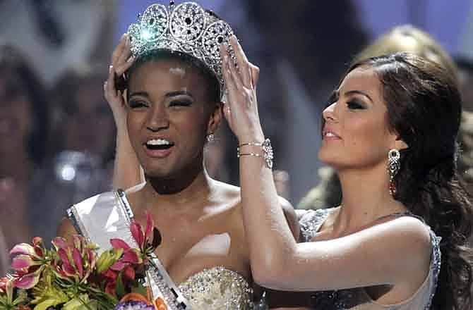 Miss Angola Leila Lopes is crowned Miss Universe 2011 by Miss Universe 2010 Ximena Navarrete, of Mexico, in Sao Paulo, Brazil, Monday Sept. 12, 2011.