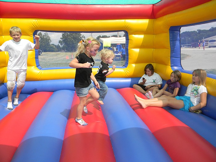 Children enjoy the bounce house.