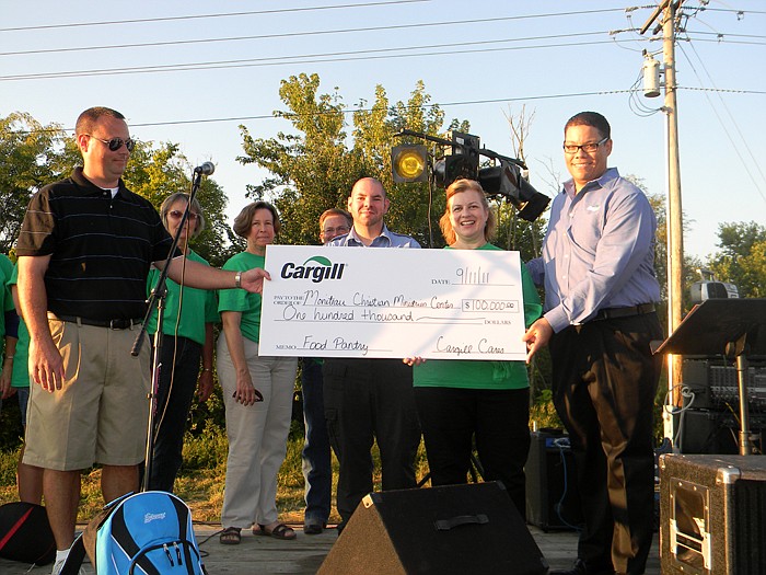 Employees of the California Cargill turkey processing operations who presented a check of $100,000 to the Moniteau Christian Ministries Center Board to go towards building the new facility which includes the Cargill Food Pantry at the Groundbreaking Ceremony held Sunday, Sept. 11 include Cargill General Manager Willard McCloud III, right, Cargill Purchasing Agent Blake Howard, left, Board President Rev. Linda Pagel, center right, and Board Vice President Bryan Wolford, center left.