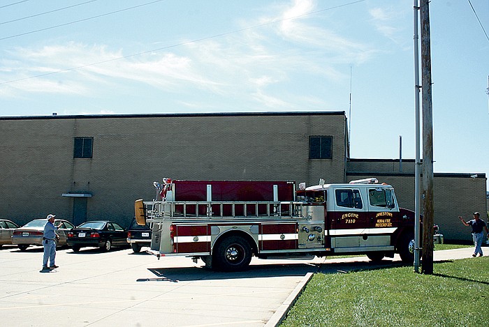 Engine 7110 of the Jamestown Rural Fire Department backs out of the Jamestown School parking lot as students and teachers file back into the building early afternoon Wednesday, Sept. 7, following a scare caused by a rooftop air conditioner unit that overheated. 