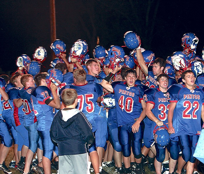 The California Pintos celebrate their win against Waraw Friday, Sept. 9, at Riley Field.