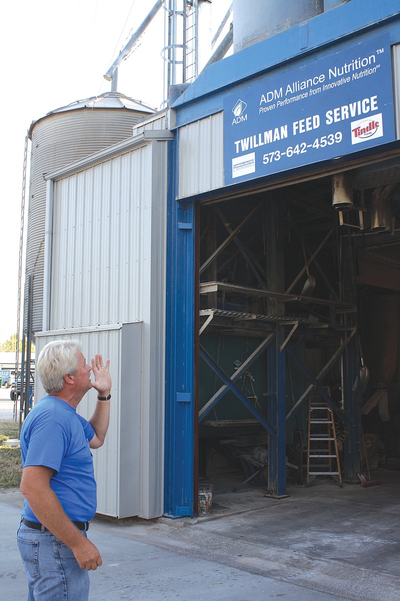 Kenny Twillman gives a tour of his business Tuesday during the Town and Country event held at Twillman Feed Serivce.