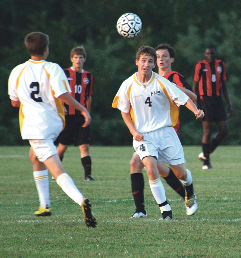 Fulton junior midfielder Jakob Hull heads a shot in the first half of the Hornets' 2-0 loss to Jefferson City on Tuesday night at the high school sports complex.