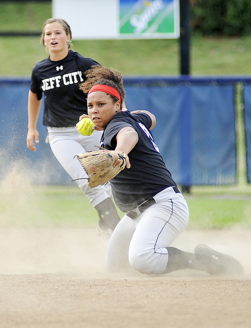 Jefferson City second baseman Madison Washington fires a ball she dug out of the dirt to get the runner at first base during Thursday's game against Blair Oaks at Lincoln Field.