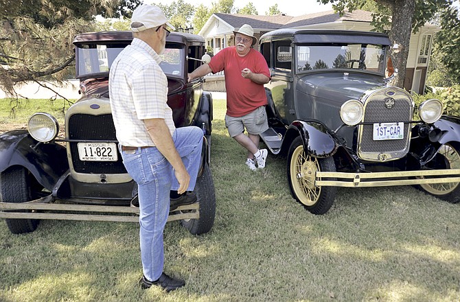 Wes Scott, left, and John Walther talk about their shared interest in Model A Fords on Tuesday afternoon. Both men and their Model A's will be at the 42nd annual Mid Mo Old Car Club show Sept. 24 in conjunction with Oktoberfest in Jefferson City. 