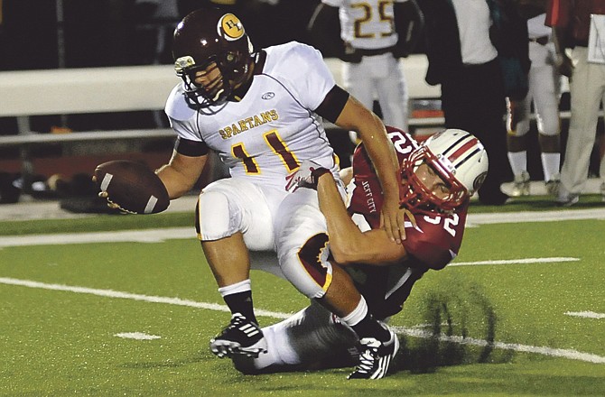 Jared Johnson of the Jays sacks Trey Hill of Hazelwood East during last Friday night's game at Adkins Stadium. The Jays blanked the Spartans 49-0.