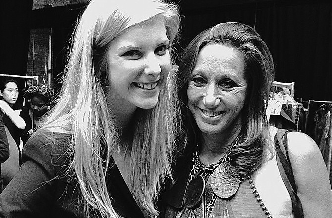 Emily Armstrong, a 2009 Helias graduate, poses with Donna Karan. Armstrong interned at Donna Karan New York and has been invited back to help behind the scenes at Fashion Week.