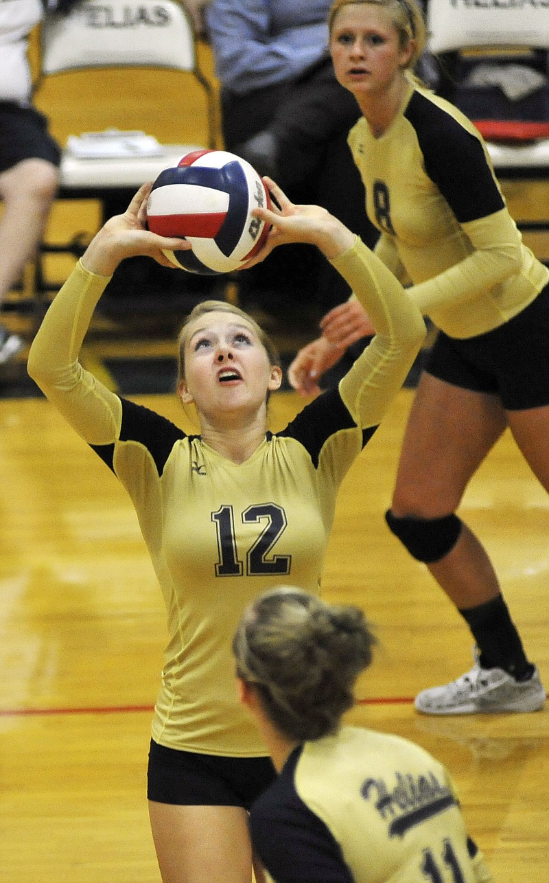 Helias' Brittney Engelbrecht sets the ball during the Lady Crusaders' win over Rolla on Tuesday at Rackers Fieldhouse.