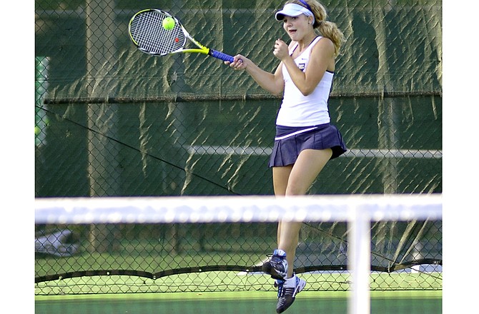 Danica Shimkus of the Helias Lady Crusaders makes a return during her match Monday against Moberly at Washington Park.
