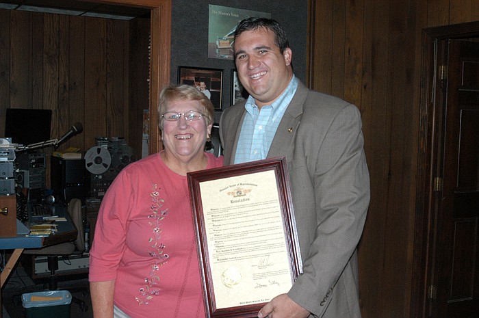 Sherry Cox, left, and Rep. Caleb Jones with a copy of the Missouri House Resolution honoring Cox for her induction into the Missouri 4-H Hall of Fame for her service to 4-H. 