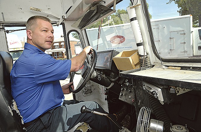 Gary Sanders moves the truck to load it in preparation for overnight milk delivery. Sanders is the home delivery supervisor for Central Dairy.