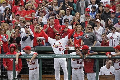 St. Louis Cardinals' Adron Chambers (56) motivates the crowd to cheer in the ninth inning of a baseball game against the Chicago Cubs, Saturday, Sept. 24, 2011 in St. Louis. Chambers later pinch-ran for Yadier Molina and scored the winning run on a wild pitch in the Cardinals 2-1 victory over the Cubs. 