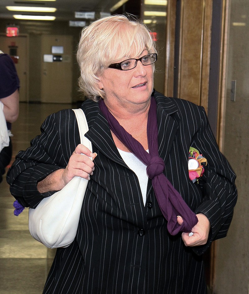 In this Sept. 23, 2011 photo, Barbara Sheehan leaves the courtroom in Queens State Supreme Court as her trial breaks for the day, in New York. Sheehan is accused of fatally shooting her retired police officer husband. Sheehan has pleaded not guilty saying the shooting was in self-defense.