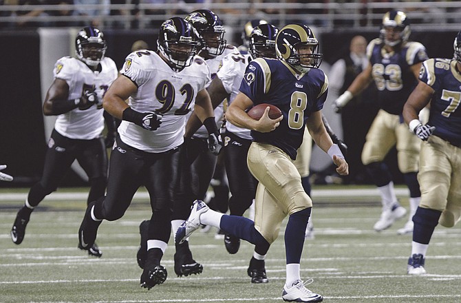 St. Louis Rams quarterback Sam Bradford (8) scrambles for yardage during the first quarter of an NFL football game against the Baltimore Ravens Sunday, Sept. 25, 2011, in St. Louis.