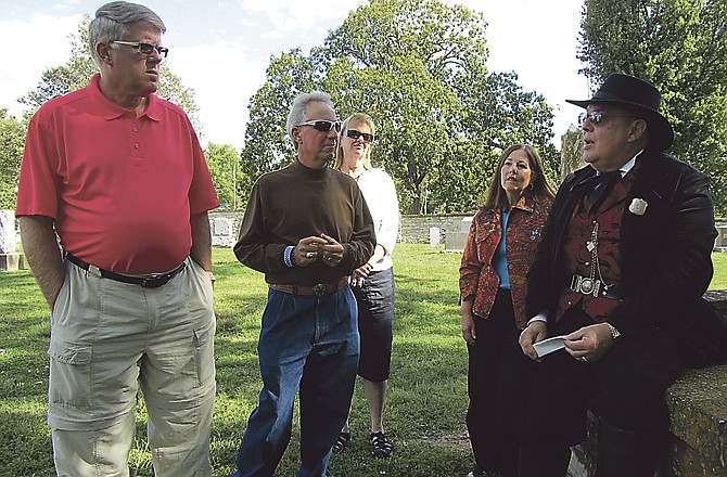 Local historian Mark Schreiber, right, discusses various founding fathers of Jefferson City buried at National Cemetery with a group taking Sunday's Civil War home tour, including, from left, Lonnie Schneider, Mike Michelson, Jan Schneider and Karen Michelson.