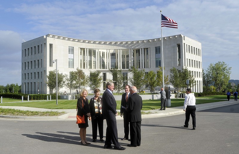 People visit shortly before the dedication Tuesday. The new courthouse, at Lafayette and State streets, is part of the U.S. Eighth Circuit Court's western district and sits on land that used to be part of the Missouri State Penitentiary.