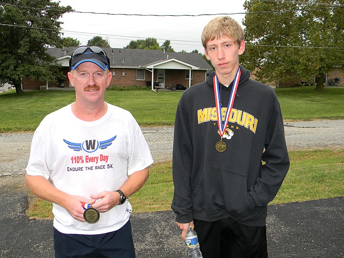 Top runners at the 2011 Ozark Ham and Turkey Healthy 5K Walk/Run; from left, are John McNay (1st) and Wade Sidebottom (3rd). Hunter Henniex (3rd) was not present.