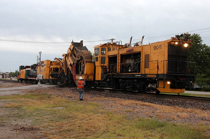 In this September 2011 photo, a huge piece of equipment comes through California, Mo., on the railroad tracks. The large machine is a railroad shoulder cleaner. 