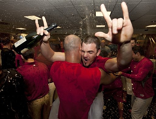 Cardinals celebrate in clubhouse after clinching playoffs