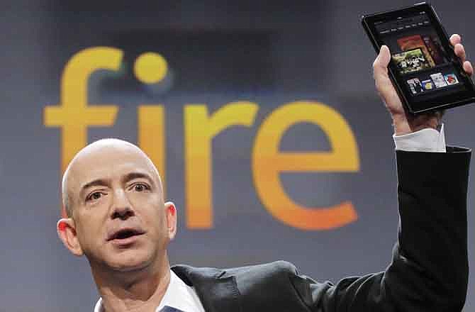 Jeff Bezos, Chairman and CEO of Amazon.com, introduces the Kindle Fire at a news conference, Wednesday, Sept. 28, 2011 in New York. The e-reader and tablet has a 7-inch (17.78 cm) multicolor touchscreen. 