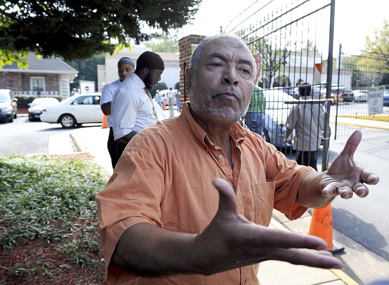 Ezeldin Diab, of Washington, talks about Anwar al-Awlaki as he leaves morning prayers Friday at the Dar Al Hijrah Islamic Center in Falls Church, Va. U.S. air strikes in Yemen on Friday killed al-Awlaki.