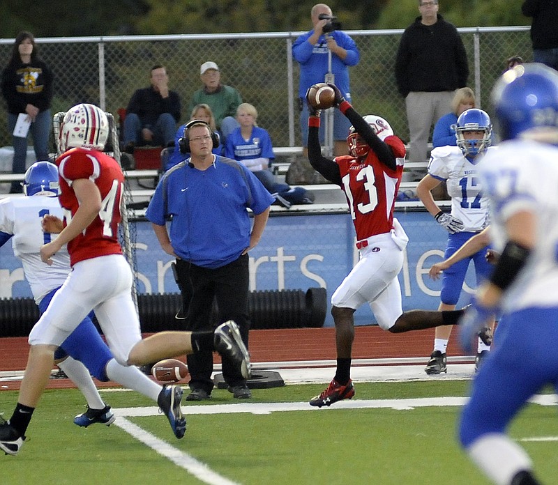 Jays receiver A.J. Miller makes a reception near the Washington sideline during Friday night's game at Adkins Stadium.