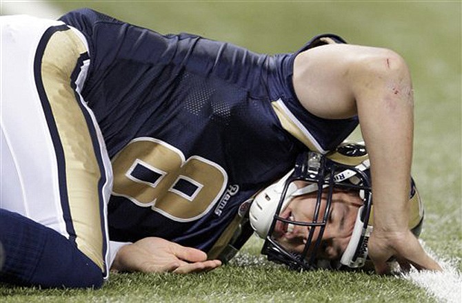 Rams quarterback Sam Bradford lies on the turf during the third quarter of Sunday's 17-10 loss to the Redskins at the Edward Jones Dome.