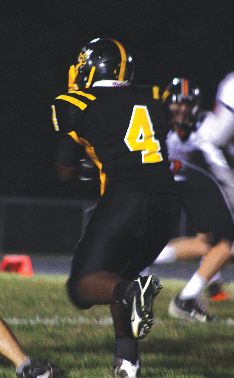 Fulton Hornets sophomore running back Kegan Lee runs the ball during the Hornets' 56-13 homecoming loss to the Kirksville Tigers on Friday at Robert E. Fisher Stadium.