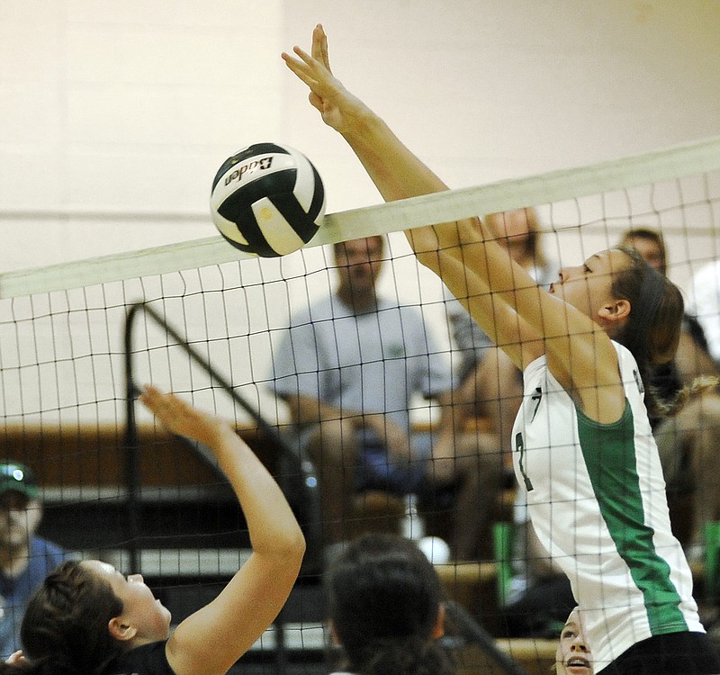 Blair Oaks' Amanda Kiso records a block in the Lady Falcons' win over Belle on Monday night in Wardsville.