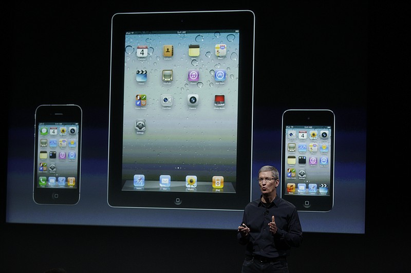 Apple CEO Tim Cook talk about iTouch, iPhone and iPad during an announcement Tuesday at Apple headquarters in Cupertino, Calif.