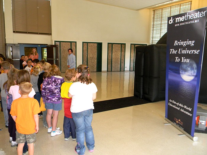 Kyle Buist from Kramer Entertainment talks to California Elementary students Wednesday, Sept. 28, before letting them inside the Dome Theater to see "Fantasy Worlds."
