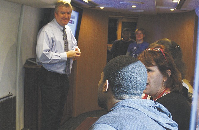 Doug Hemming, C-SPAN marketing specialist, explains C-SPAN social networking efforts to Westminster College political science students touring the C-SPAN Campaign 2012 bus as part of Professor Tobias Gibson's Wednesday morning political science class.