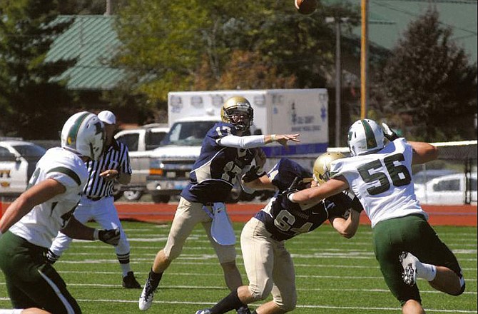 Helias quarterback Aaron Vossen throws a pass during last Saturday afternoon's game against the Rock Bridge Bruins at Adkins Stadium. 