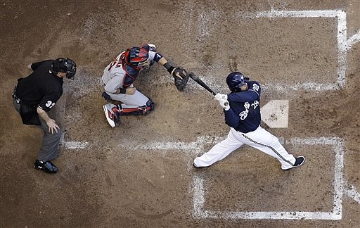 Milwaukee Brewers' Prince Fielder hits a two-run home run during the fifth inning of Game 1 of baseball's National League championship series against the St. Louis Cardinals Sunday, Oct. 9, 2011, in Milwaukee.