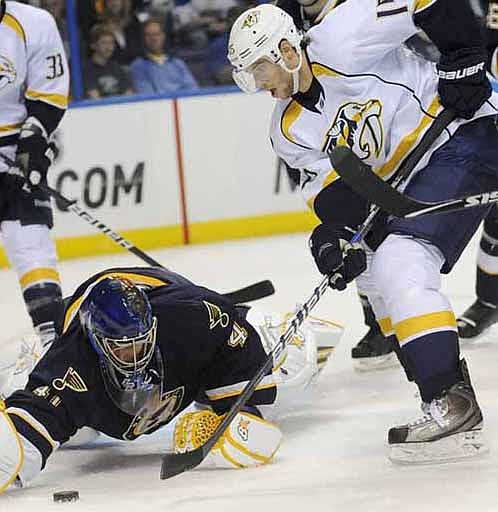St. Louis Blues' goalie Jaroslav Halak (41), of Slovakia, blocks a shot by Nashville Predators' Craig Smith (15) in the first period of an NHL hockey game Saturday, Oct. 8, 2011, in St. Louis. 